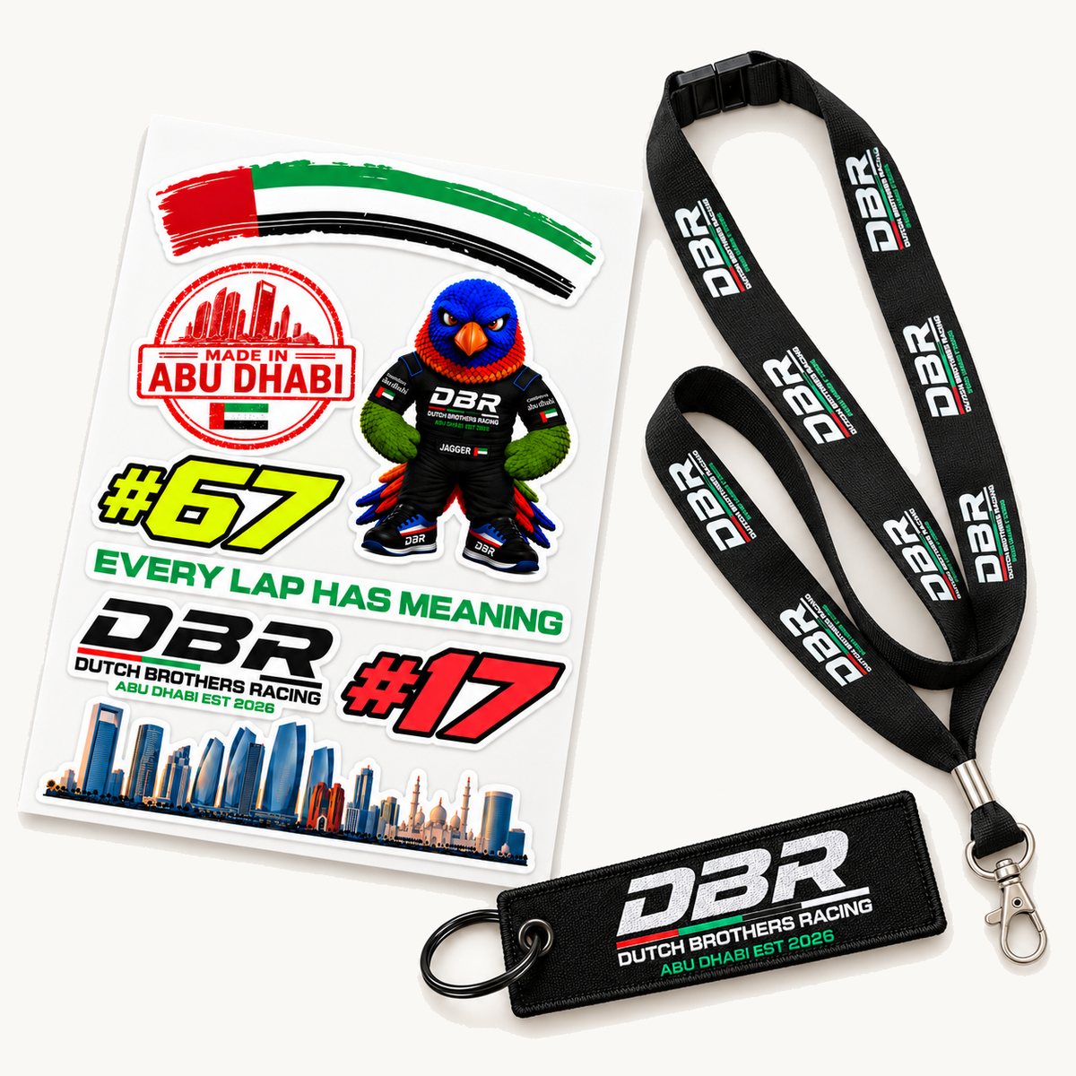The Dutch Brothers Racing Paddock Pack, showing the sticker sheet, the black DBR lanyard and the woven DBR keyring together.