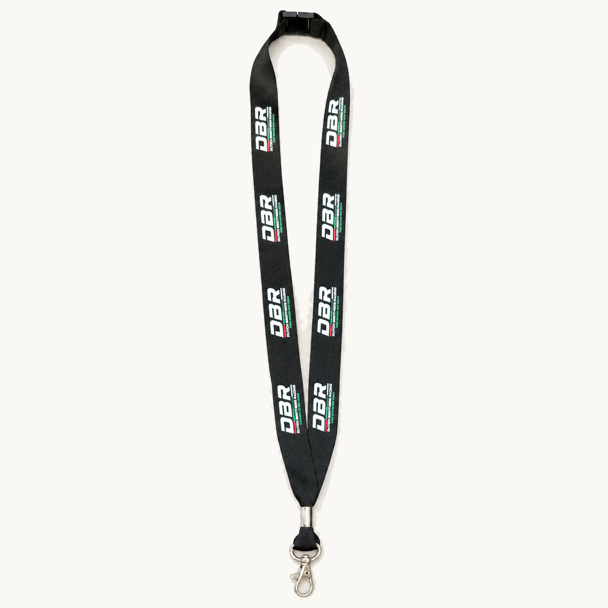 The Dutch Brothers Racing lanyard in black, with the DBR wordmark repeated in white down the webbing, a safety breakaway at the neck and a metal swivel trigger clip.