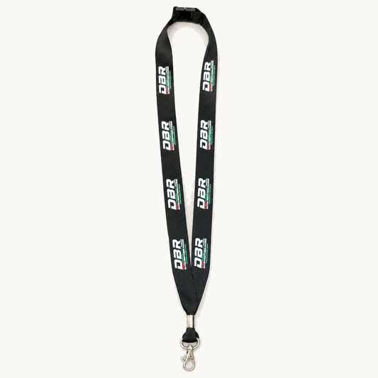 The Dutch Brothers Racing lanyard in black, with the DBR wordmark repeated in white down the webbing, a safety breakaway at the neck and a metal swivel trigger clip.
