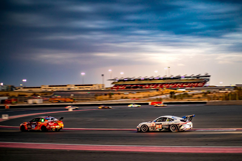 Race cars competing at Dubai Autodrome during the Hankook 24H Dubai.