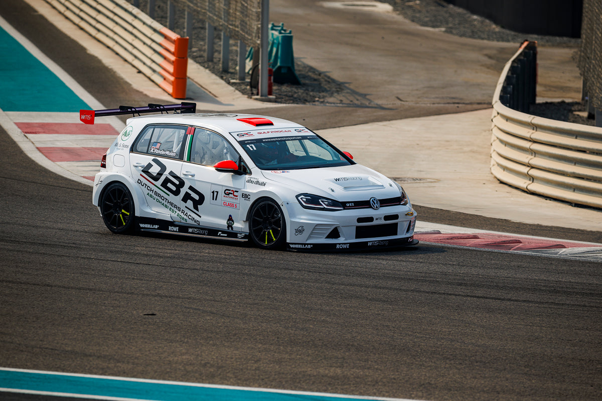 The number 17 Dutch Brothers Racing Golf turning in on the blue and white kerbing at Yas Marina Circuit.