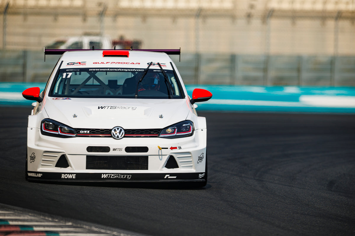 The Dutch Brothers Racing Golf head-on at speed, the number 17 across the top of the windscreen.