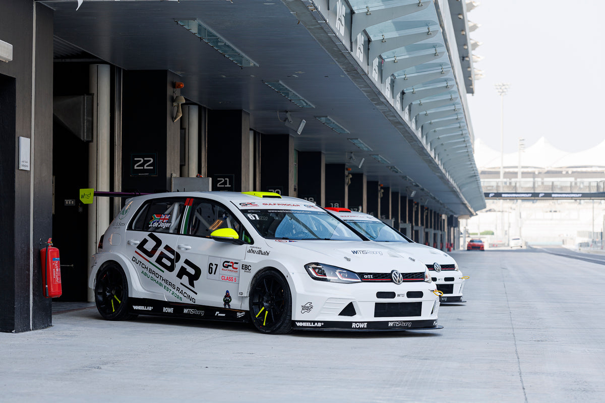 The Dutch Brothers Racing Golf waiting in the pit lane outside garages 21 and 22 at Yas Marina Circuit.