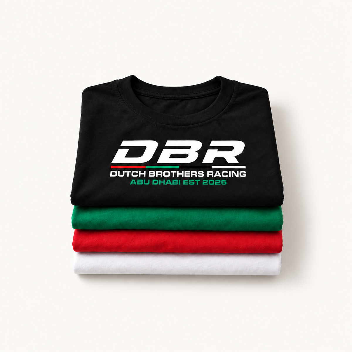 Four Dutch Brothers Racing tees folded in a stack, black on top with the DBR logo, then green, red and white.